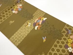 七宝に籠目・蝶・草花模様織出し名古屋帯